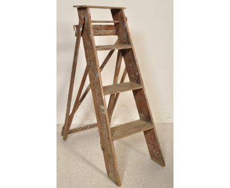 A pair of 20th century vintage circa 1980s wooden A frame step ladders with graduating steps and wooden frame. Measures 104 c