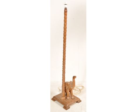 A vintage retro 20th century 1970s hardwood carved floor standard lamp. The lamp having a carved palm tree effect column with