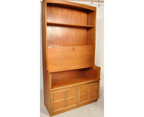 A vintage retro 20th century circa 1970s teak wood veneer wall unit / bookcase cabinet by Nathan of a tall form with fixed sh