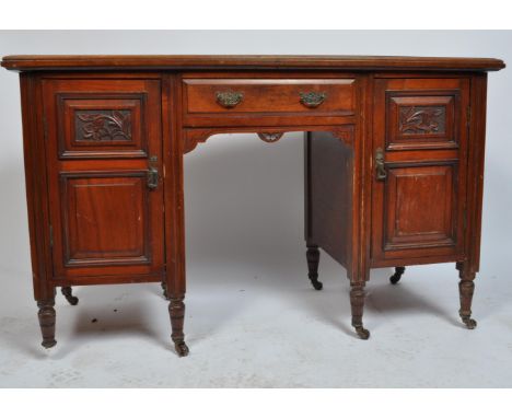 A 19th century late Victorian mahogany twin pedestal writing desk / table. The desk of a rectangular form with single drawers