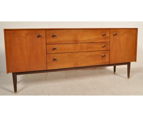 A retro vintage mid 20th century circa 1960s G plan teak wood sideboard having a central bank of drawers flanked by single do