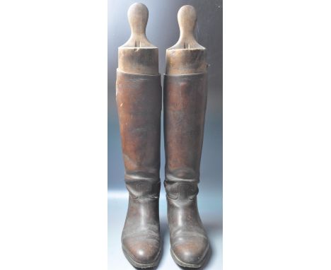 A pair of early 20th century Irish hunting boots by L J Watkins. The brown leather boots of a classical design with pointed t