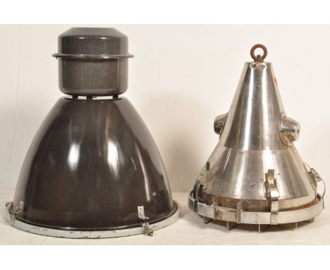 A pair of large 20th century circa 1970S industrial factory lights to include a large Thorax grey pendant light shade and ano
