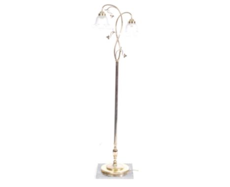 A retro vintage 1970s Century Hollywood Regency standard lamp light having twin branches with botanica decoration and glass s