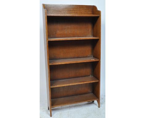 A 1920's George VI upright open window bookcase. The bookcase of solid mahogany construction having an open window front with