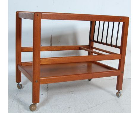 A vintage retro 1960’s Danish inspired teak wood trolley / two tier trolley / serving trolley having a rectangular top with s