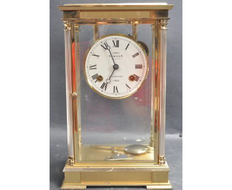 A large 20th century circa 1980's Sewills of Liverpool brass cased carriage clock with exposed workings and roman numeral to 