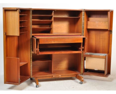 A retro vintage 1970's Scandinavian teak wood office Industrial cube desk - filing cabinet having twin doors, raised on casto