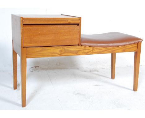 A vintage retro mid 20th century teak wood telephone table / seat. The telephone table of a rectangular form with brown vinyl