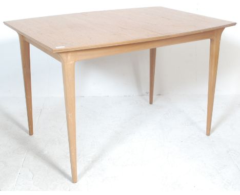 AH McIntosh &amp; Co of Kirkaldy - A retro vintage 1970's British Design teak wood dining table having a two piece rectangula