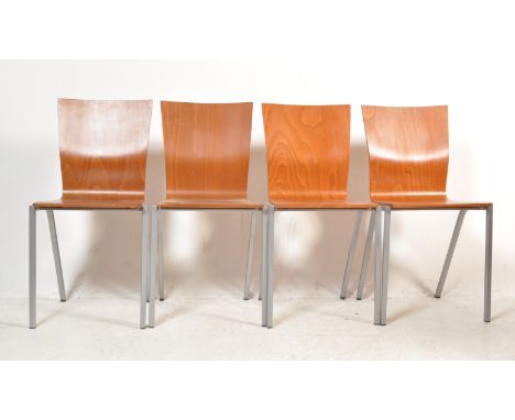 A set of four vintage retro 20th century Italian dining chairs having plywood shell type backrest and seat raised on chrome m