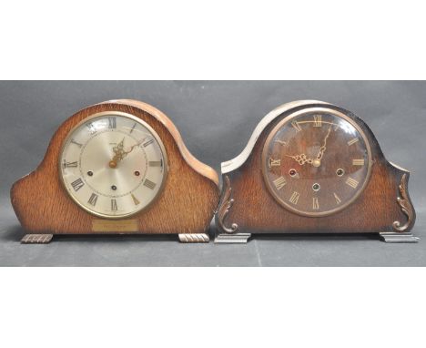 A pair of 1930s Smiths Napoleon mantle clocks to include a walnut clock with carved serpentine wooden details to the case, al