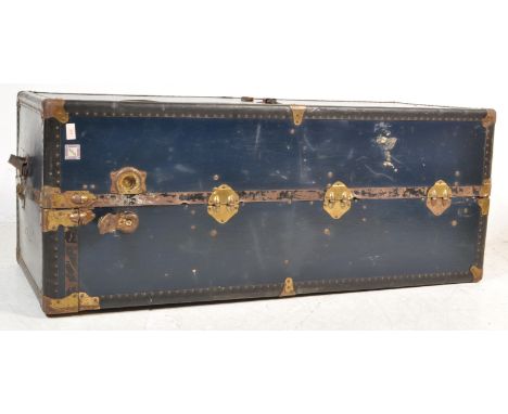 A large early 20th century shipping trunk / chest / cargo wardrobe of a rectangular form with metal banded corners, hinged li