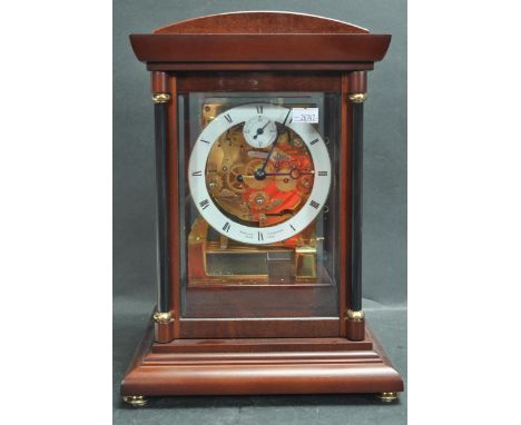 A 20th century Sewills of Liverpool mantle clock in the manner of the Kieninger 'Bradley' clock, with exposed mechanism. Mark