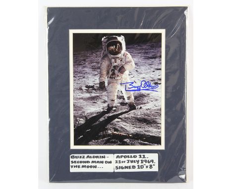 Autographs: Buzz Aldrin Apollo 11 Mission, 1969  a colour photograph, 7 x 9 inches within mount, Signed in blue ink by the fo