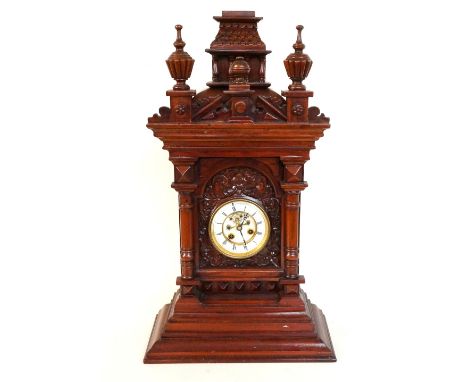 19th CENTURY EIGHT DAY BRACKET CLOCK
with a visible escapement to the circular brass and enamel dial, contained in an ornate 