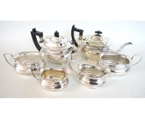 TWO VINTAGE SILVER PLATED TEA SERVICES
each comprising teapot, sugar basin and milk jug (6)