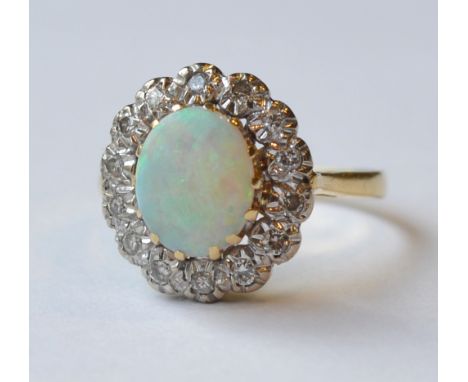 OPAL AND DIAMOND CLUSTER DRESS RING
on gold shank, ring size Q