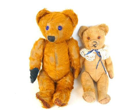 PLUSH GROWLING TEDDY BEAR
with glass button eyes and articulated limbs, together with a clockwork musical plush teddy bear wi
