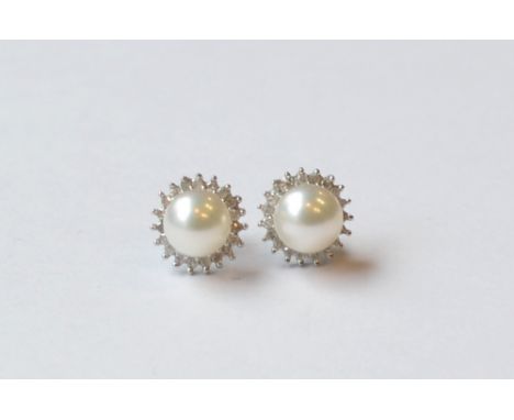 PAIR OF DIAMOND AND PEARL STUD EARRINGS
the central pearl on each in diamond surround, in all the diamonds totalling approxim