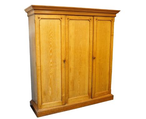 LARGE LATE VICTORIAN LIGHT ASH WARDROBE
the stepped cornice above single and double door sections, the single section interio