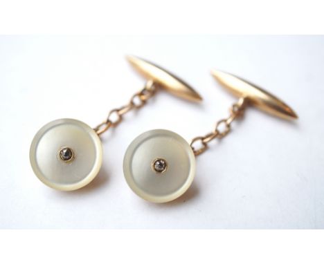 PAIR OF MOTHER OF PEARL AND DIAMOND CUFFLINKS
in nine carat gold