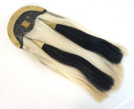 VINTAGE SCOTTISH HORSE HAIR SPORRAN
with a brass cantle and emblem of 'Glasgow University O.T.C.', the white horse hair with 