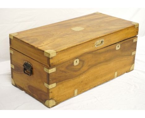 CAMPHOR WOOD TRUNK
with a brass plaque to the lift up lid and brass corner caps, and with iron side carrying handles, 91.5cm 