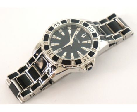 GENTLEMAN'S BULOVA WRISTWATCH
the black dial and the bezel set with diamonds, with date aperture, on stainless steel and blac