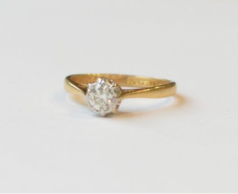 DIAMOND SOLITAIRE RING
in eighteen carat gold and platinum, the round cut diamond approximately 0.3cts, ring size J-K