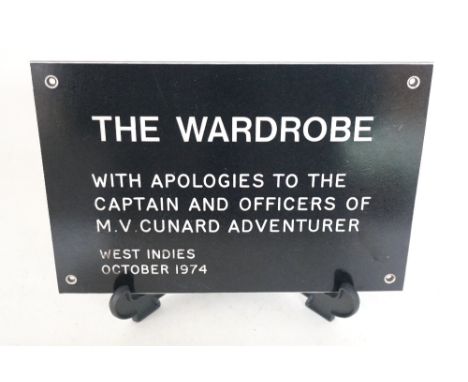 CUNARD CRUISE LINER INTEREST -
a door plaque inscribed 'The Wardrobe - with apologies to the Captain and Officers of M.V.Cuna