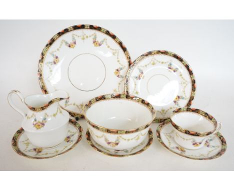 EDWARDIAN ROYAL ALBERT CROWN CHINA TEA SET
with floral decoration on white ground, comprising nine cups, twelve saucers, twel