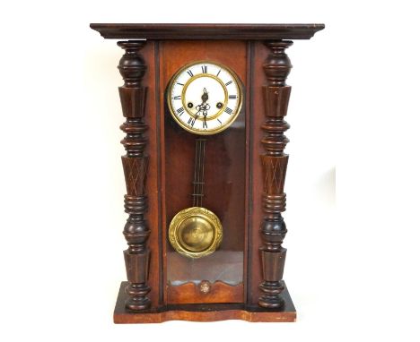 VICTORIAN STAINED PINE VIENNA WALL CLOCK
with shaped column case, black Roman numerals on white enamel dial, key and pendulum