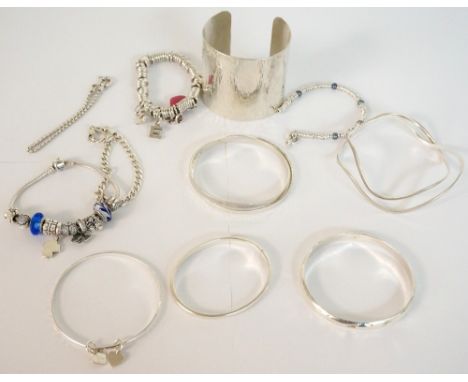 SELECTION OF SILVER BRACELETS AND BANGLES
including a Links of London bracelet with charms, a Pandora bracelet with various c