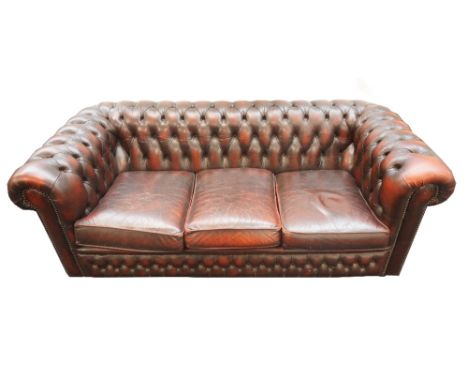 CHESTERFIELD THREE SEAT SOFA
in Ox blood red leather with button back and scroll arms, 186cm wide 