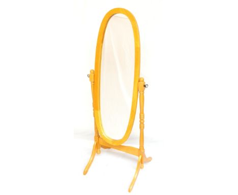 PINE OVAL CHEVAL MIRROR
with turned supports and shaped base, 150cm high