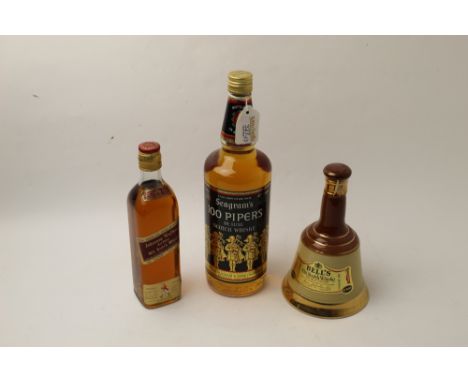 Bottle of Seagram's 100 Pipers Deluxe Scotch Whisky, bottle of Johnnie Walker Whisky and Bells Whisky bell  