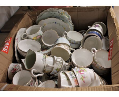 Box of mixed patterned teacups, saucers and plates