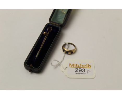 Yellow metal ring, weight 3.2 grams, and two tie pins 