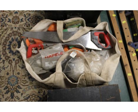Bag of tools - saws, sharpening stone etc