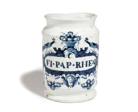A DELFT POTTERY DRY JUG JAR C.1740-60 painted in blue with a basket of flowers flanked by a pair of peacocks above a banner i
