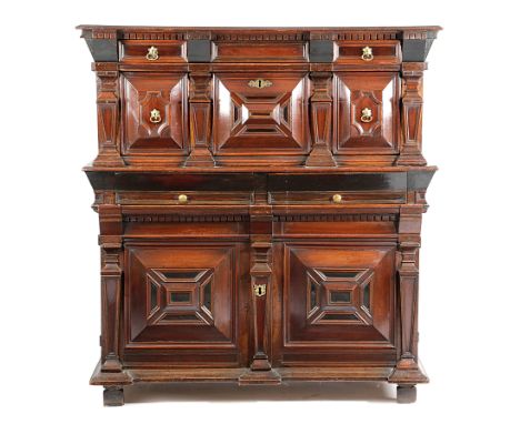 A FINE CHARLES II CEDAR AND SNAKEWOOD ENCLOSED CHEST C.1670 of architectural form, in three sections, the boarded top with a 