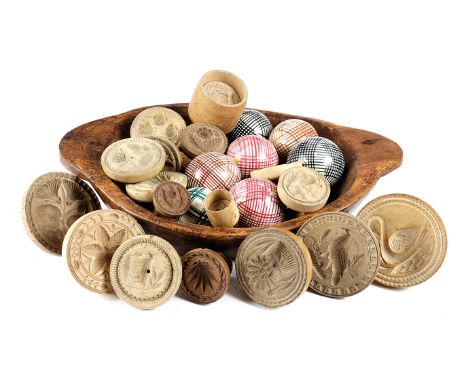 SEVENTEEN TREEN BUTTER STAMPS / MOULDS 19TH CENTURY AND LATER the majority sycamore, with various designs, together with seve