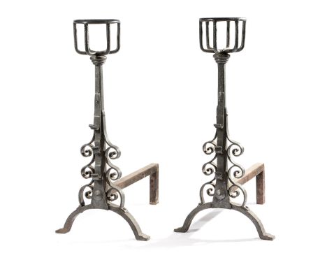 A PAIR OF WROUGHT IRON ANDIRONS IN 17TH CENTURY STYLE each with a bottle holder top and with scroll decoration, together with