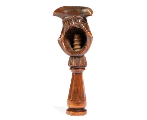 A SWISS TREEN NOVELTY NUTCRACKER 19TH CENTURY carved as a bust of a man wearing a tricorn hat, the other side with his mouth 