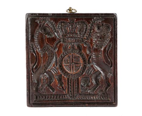 A TREEN CONFECTIONERY MOULD / STAMP 19TH CENTURY intaglio relief carved with the Royal Coat of Arms, with a gilt metal suspen