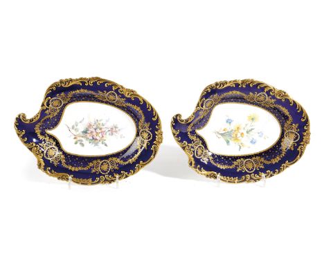 A PAIR OF ROYAL CROWN DERBY PRESENTATION DISHES FROM THE VERNON-HARCOURT SERVICE of leaf shape, the centres painted with flow