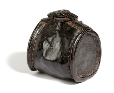 A LEATHER COSTREL LATE 17TH / EARLY 18TH CENTURY of shouldered form, with an open spout, pierced with two holes and with stit