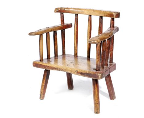 AN IRISH SYCAMORE AND ASH PRIMITIVE CHILD'S CHAIR 19TH CENTURY with traces of red painted decoration, with a curved top rail 