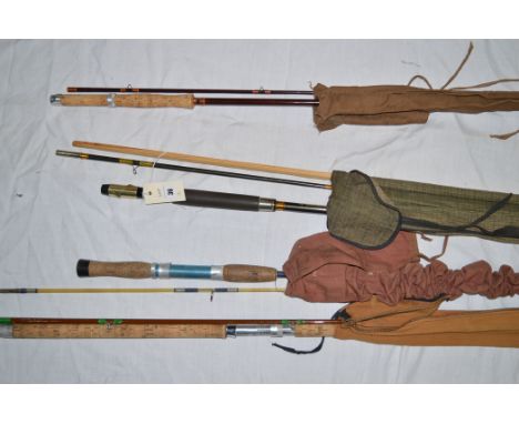 Four fishing rods: Abu Diplomat 8 1/2ft. two-piece spinning rod; Greys of Alnwick two-piece 8 1/2ft. spinning rod; Silver Cre